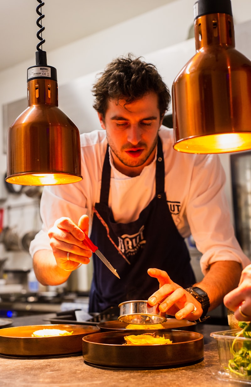 A chef plating food